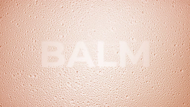 Balm writing blown off the wet glass on beige background