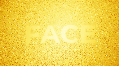 Face text blown off the wet glass on yellow background