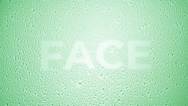 Face text blown off the wet glass on green background