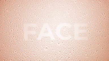 Face text blown off the wet glass on beige background