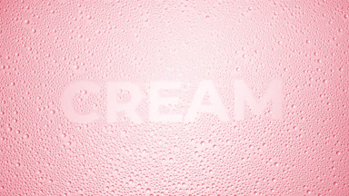 Cream word blown off the wet glass on pink background