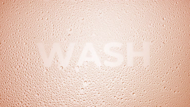Wash inscription blown off the wet glass on beige background