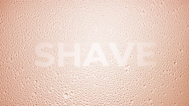 Shave word blown off the wet glass on beige background