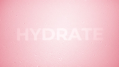 Hydrate writing blown off the wet glass on pink background