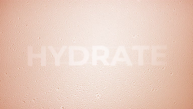 Hydrate writing blown off the wet glass on beige background