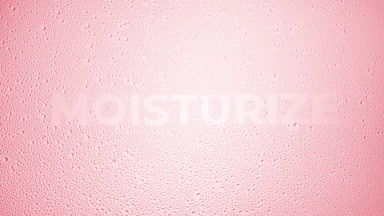 Moisturize text blown off the wet glass on pink background