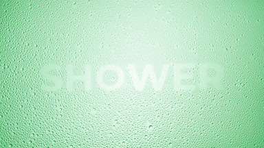 Shower word blown off the wet glass on green background