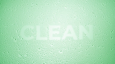 Clean word blown off the wet glass on green background