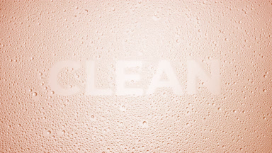 Clean word blown off the wet glass on beige background