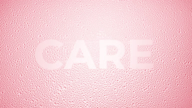 Care text blown off the wet glass on pink background