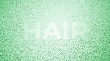 Hair inscription blown off the wet glass on green background