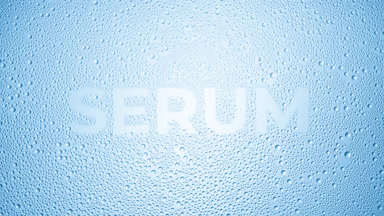 Serum word blown off the wet glass on blue background