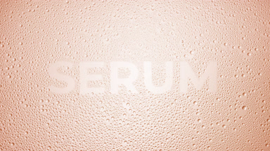 Serum word blown off the wet glass on beige background