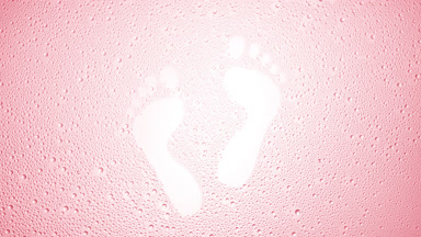 Footprints blown off the wet glass on pink background