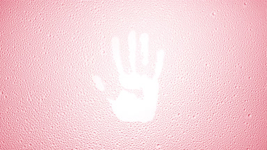 Handprint blown off the wet glass on pink background