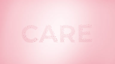Care word blown off the wet glass on pink background
