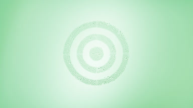 Target sign blown off the wet glass on green background