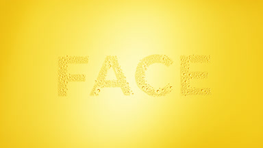Face text blown off the wet glass on yellow background