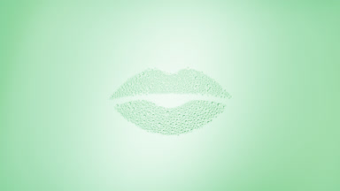 Lips shape print blown off the wet glass on green background