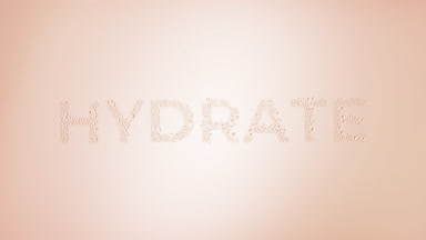 Hydrate text blown off the wet glass on beige background