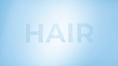 Hair word blown off the wet glass on blue background
