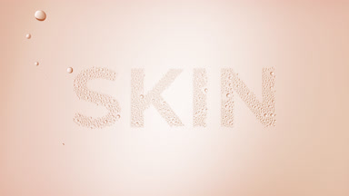 Skin word blown off the wet glass on beige background