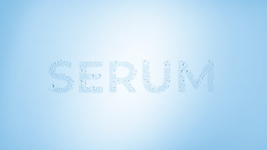 Serum inscription blown off the wet glass on blue background
