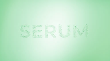 Serum inscription blown off the wet glass on green background