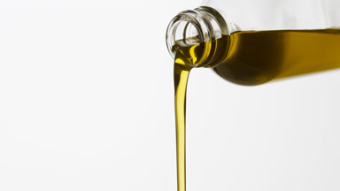 Reagent bottle is being tilted and chamomile oil pours from it