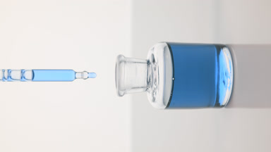 Lab dropper drips cyan liquid into bottle on grey background
