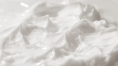 Macro jib shot of white cosmetic cream surface