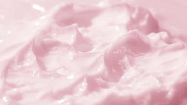 Macro jib shot of pink cosmetic cream surface