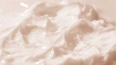 Macro jib shot of beige cosmetic cream surface