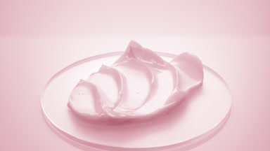 Pink cosmetic cream on watch glass round on pink background