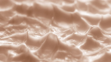 Side view macro turntable shot of beige cream texture in shadow