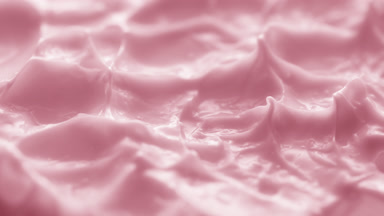 Jib macro turntable shot of pink cream texture in shadow