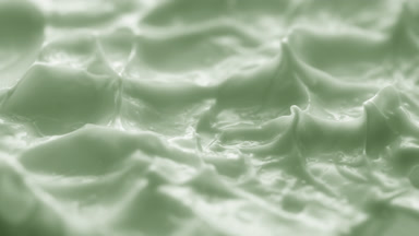 Jib macro turntable shot of green cream texture in shadow