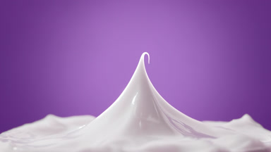 White cap has been removed from white cream on purple background