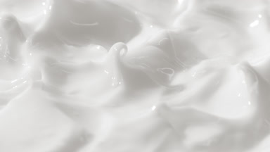 Side view turntable shot of white cream surface with peaks