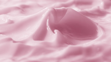 Side view turntable shot of pink cream surface with peak