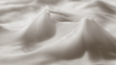 Crane shot of glass has been removed from the white cream