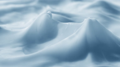 Crane shot of glass has been removed from the blue cream