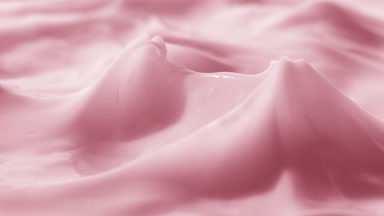 Crane shot of glass has been removed from the pink cream