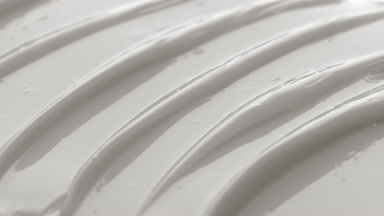 Macro texture of white moisturizing cream with hyaluronic acid