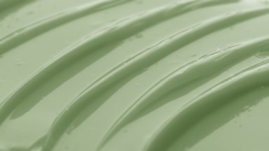 Macro texture of green moisturizing cream with green tea oil