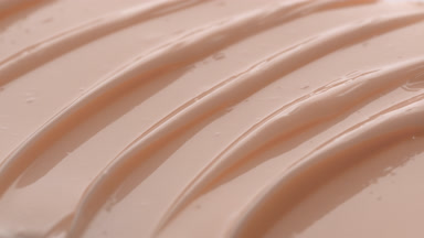 Macro texture of beige moisturizing cream with hyaluronic acid