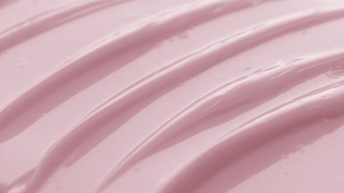 Jib macro texture of pink nourishing cream with rose oil
