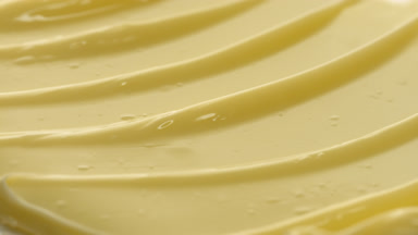Texture of yellow eye cream with vitamin C and goji extract