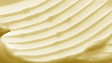 Crane macro texture of yellow day cream with vitamin C