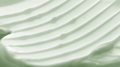 Crane macro texture of green day cream with tea tree oil